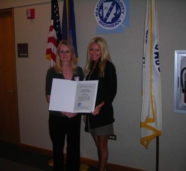 We love volunteers - Carey honors her constituent with an award for all her hard work at Wyandot Middle School.