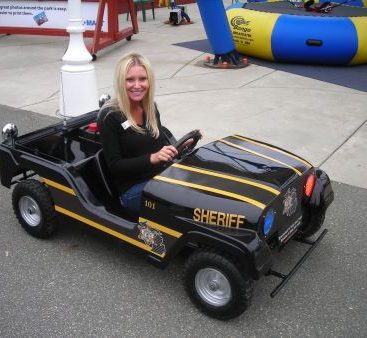 Hackel's Fundraiser - Carey tests the Sheriff's Go cart during his fundraiser at Barrymore's