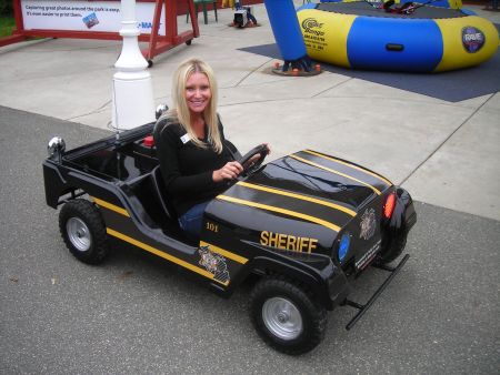 Hackel's Fundraiser - Carey tests the Sheriff's Go cart during his fundraiser at Barrymore's