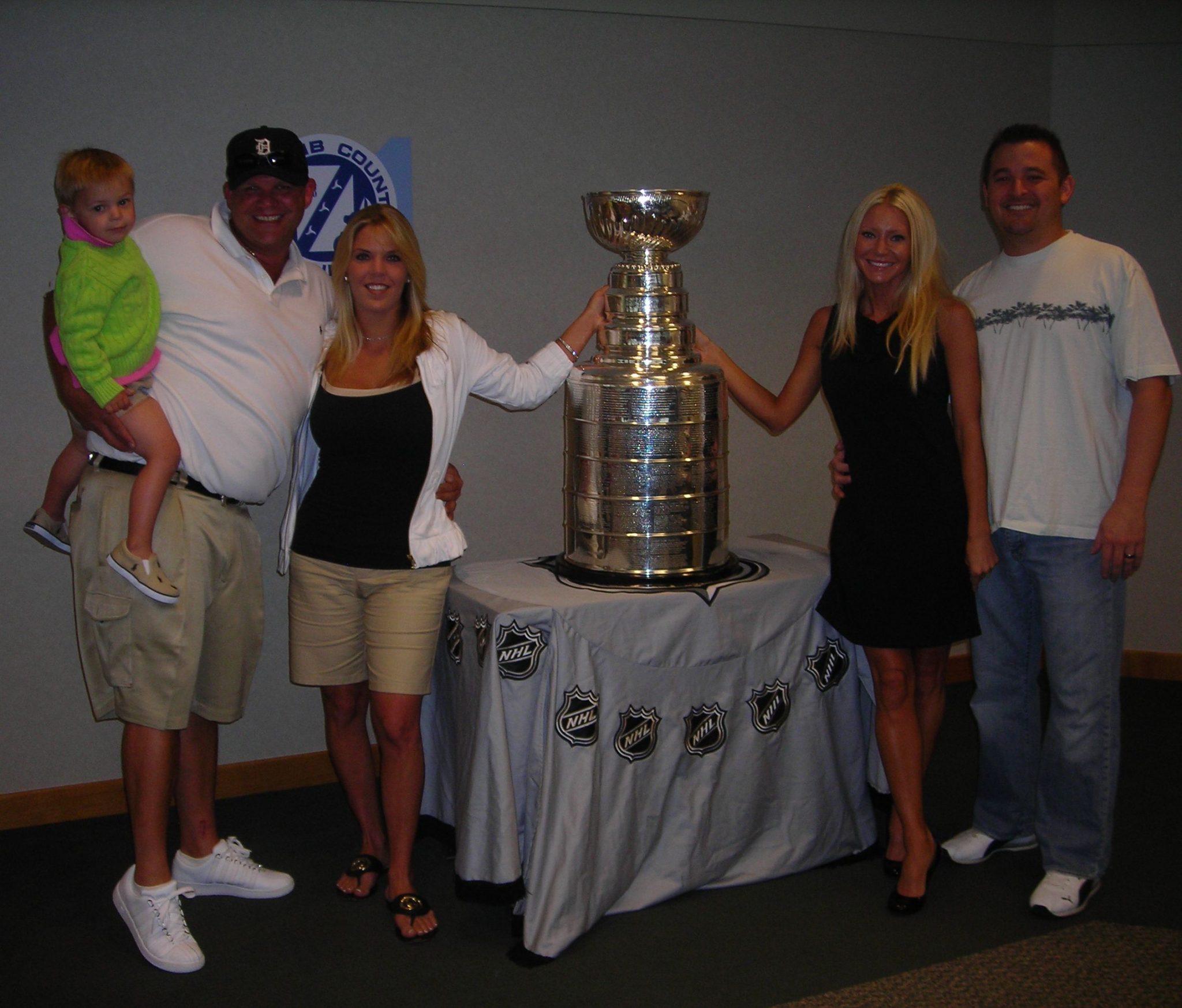 Go Red Wings! - Carey and her Husband Mike with their good friends Leo and Kelly Salvaggio and their Son Nino posing