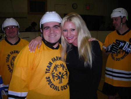 Carey and Chris - Carey attends a Special Olympics hockey game in Farmington