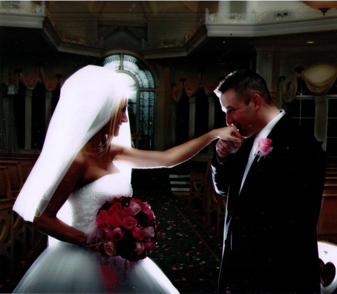 Disney World wedding - Mike kisses Carey's hand