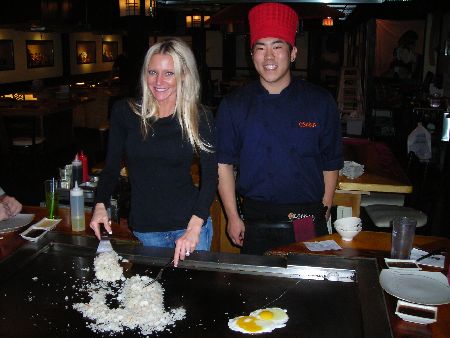 Osaka Japanese restaurant - Carey is taught how to cook fried rice by Chris. The restaurant is located on Hall road