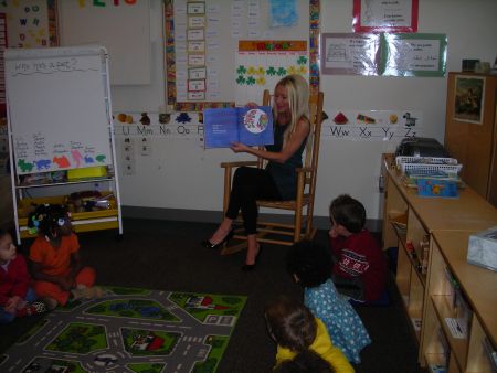 Carey reads to children - Carey teaches the children how much fun it is to read!