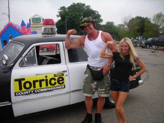 Carey at the Gratiot Cruise - Carey Torrice has bigger muscles than Mike Bloomquist of Powerhouse Gym!
